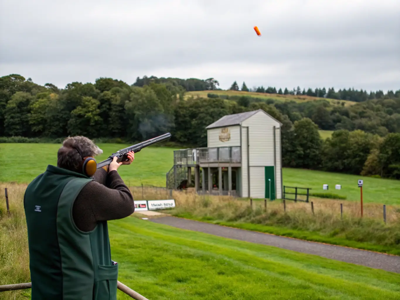 A serene image of club members participating in a clay shooting activity in a natural setting, highlighting the outdoor and recreational aspects of the club.