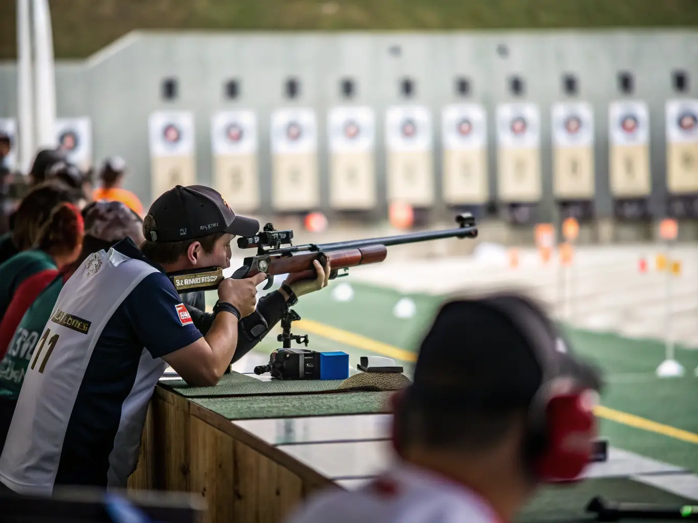 An action shot of participants engaged in a dynamic shooting competition at the CTSC CLUB DE TIR DE SAINT COUTANT, showcasing the intensity and skill involved in competitive shooting sports.